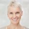 woman with a blonde pixie haircut